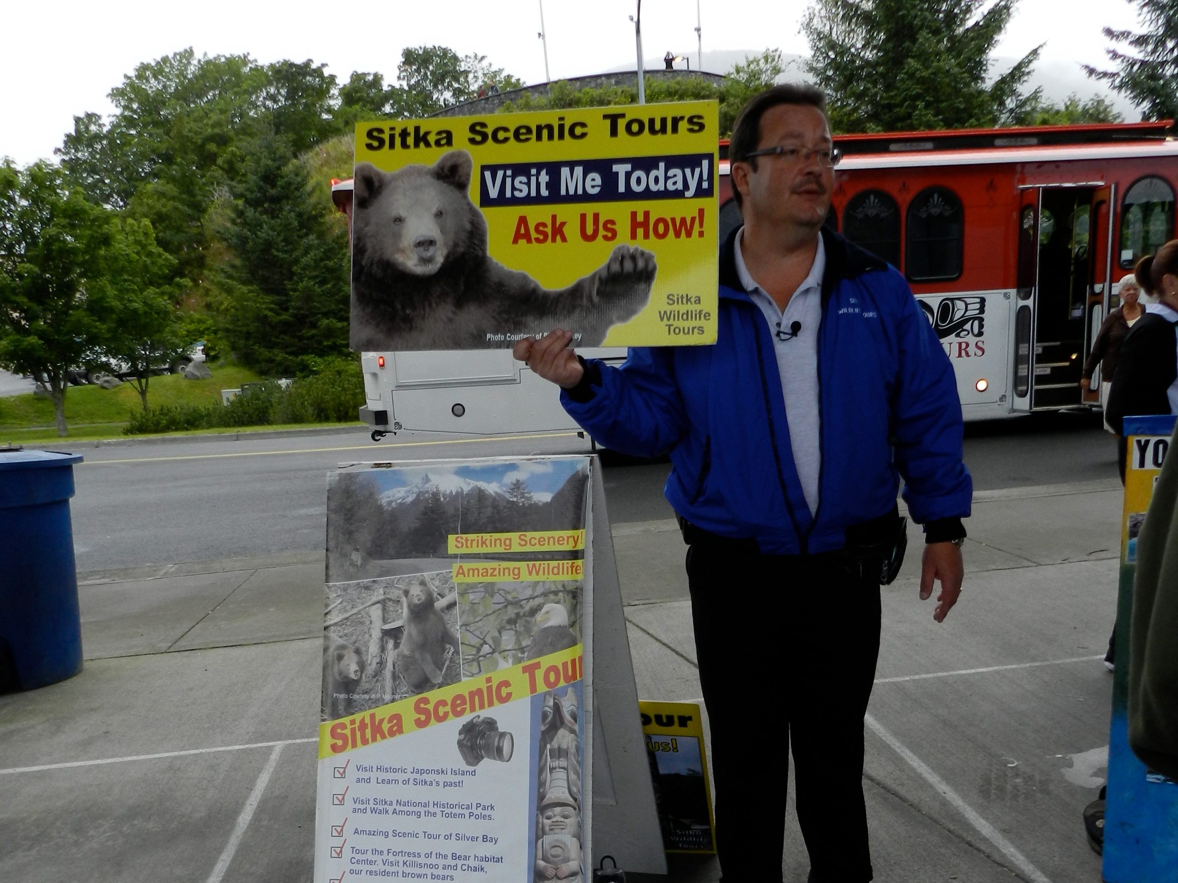 Owner with Sitka Scenic Tours sign